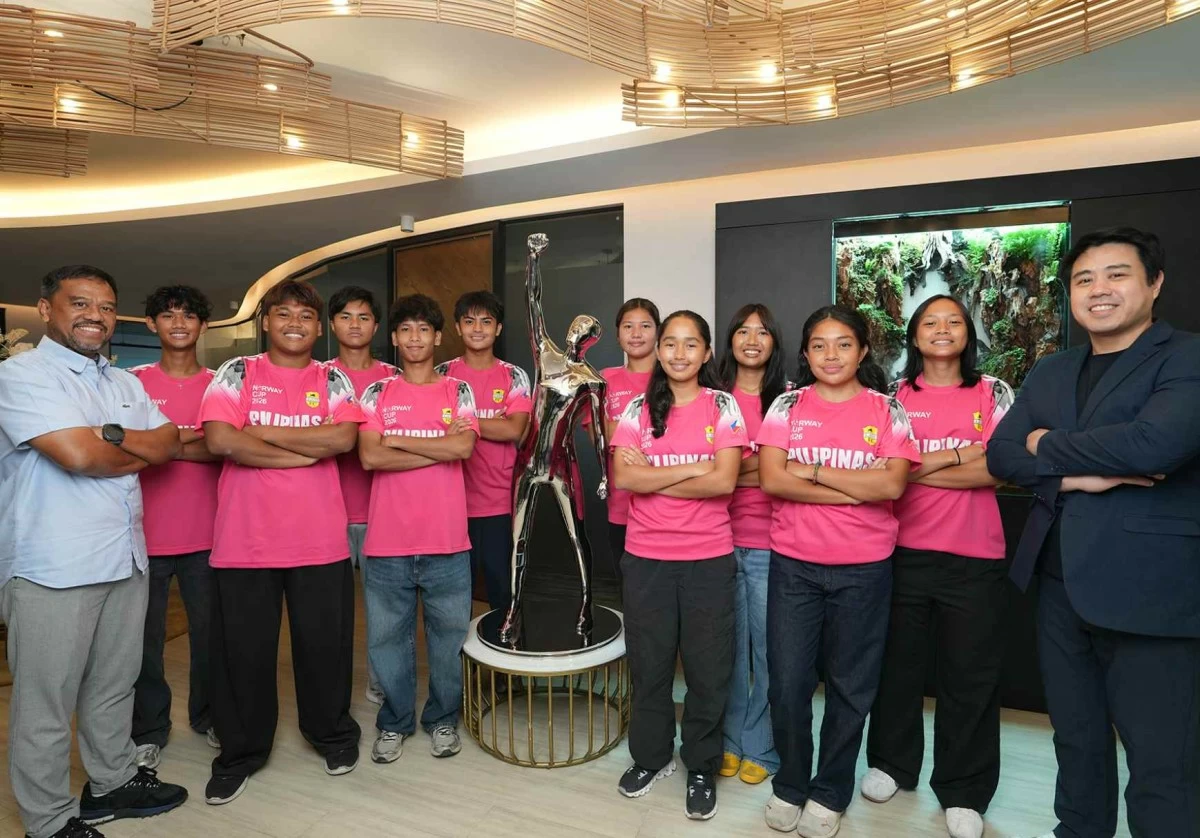 Members of LAOS FC’s boys’ and girls’ teams pose with the Victor as they prepare to represent the Philippines on the international stage.
