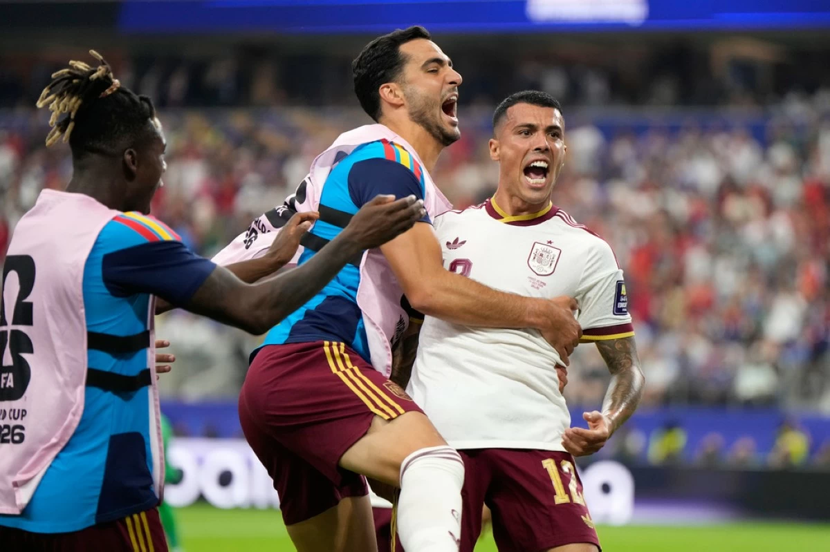 Spain's Pedro Porro, right, celebrates with Mikel Merino and Nico Williams, left, after scoring his side's second goal during the World Cup semifinal soccer match between France and Spain in Arlington, Texas, near Dallas, Tuesday, July 14, 2026. (AP Photo/Ashley Landis)