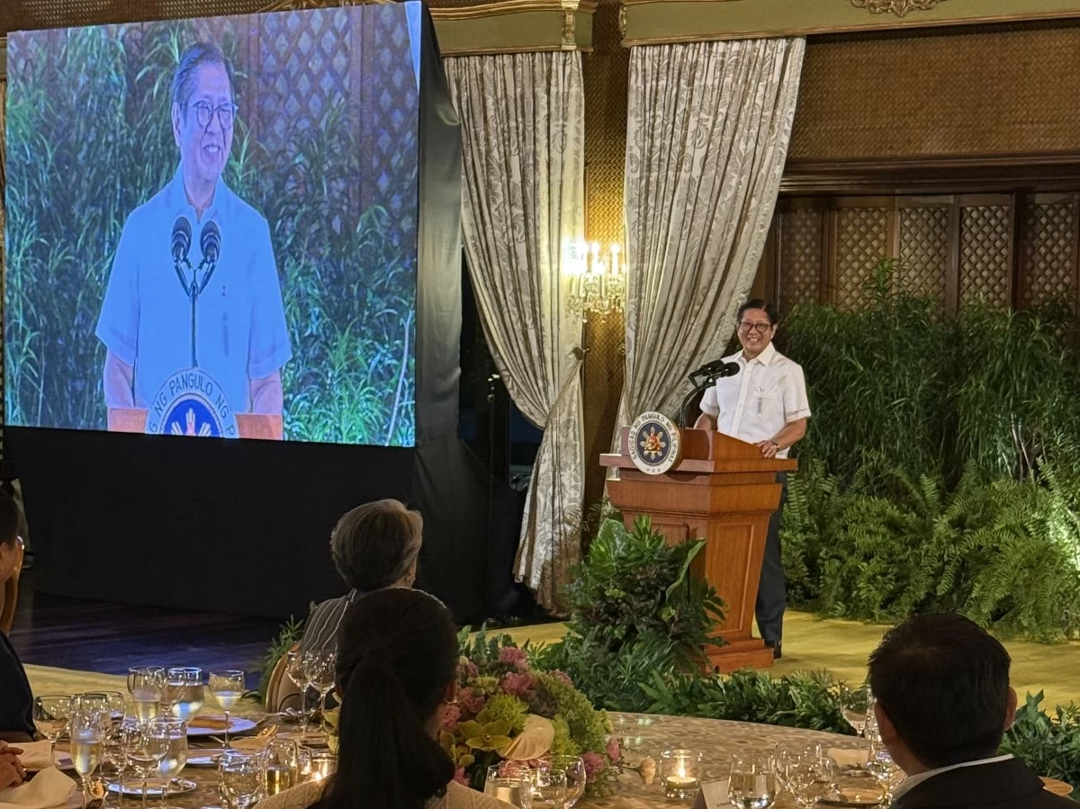 The President in a very light mood, welcoming Alex to the Palace.