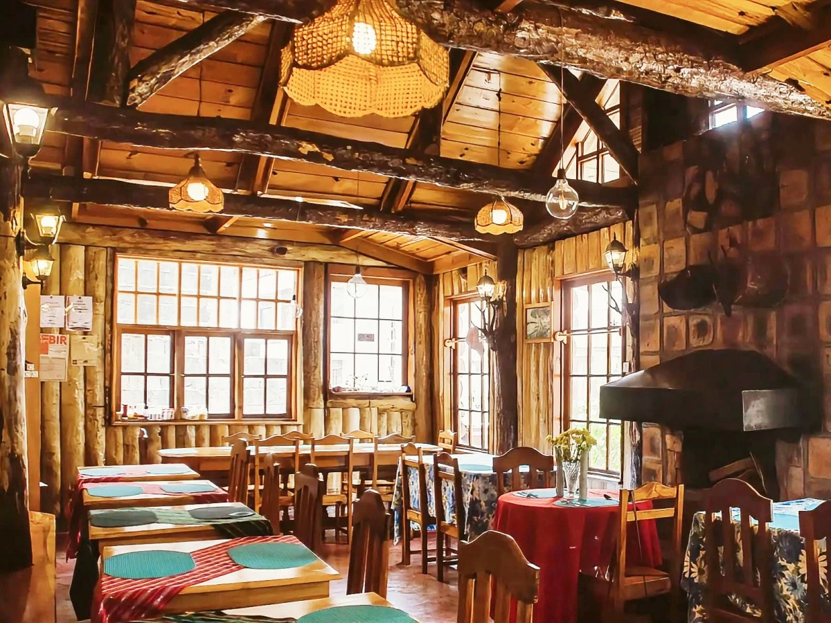 LOG CABIN SAGADA’s warm, rustic interiors.