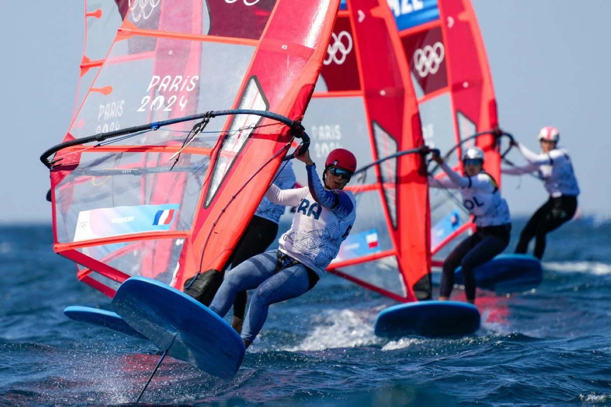 Helene Noesmoen, of France, leads a pack while competing in a women's iQFOiL windsurfing class quarterfinal race during the 2024 Summer Olympics, Aug. 3, 2024, in Marseille, France. (AP Photo/Carolyn Kaster, File)
