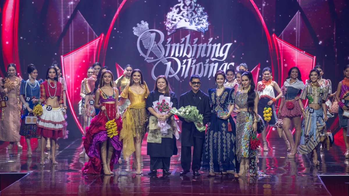 Multi-awarded Filipino bag designer Zarah Juan (middle left) and high-fashion jeweler Arnel Papa (middle right) are recognized on stage following the opening fashion show featuring their creations.
