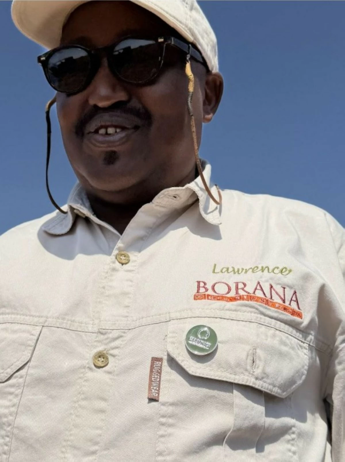 Lawrence, my guide at Borana Conservancy, shares a moment of birdwatching during one of our game drives.
