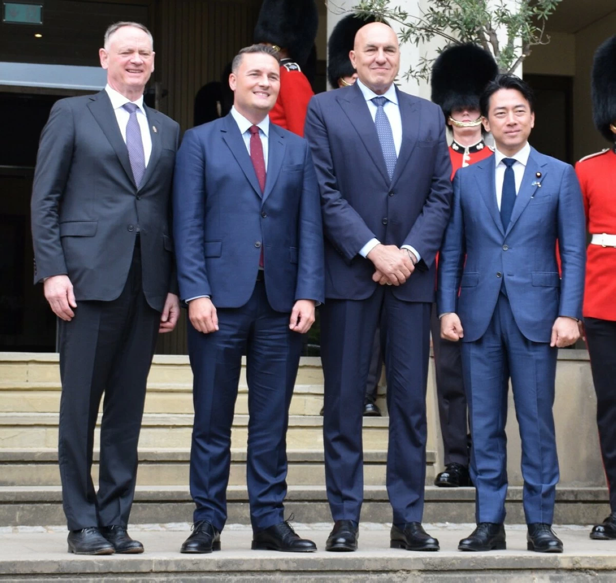 Japanese Defense Minister Shinjiro Koizumi (far right) and others pose for a photo before the Japan-Britain-Italy-Canada defense ministers' meeting in London on Tuesday (July 21).