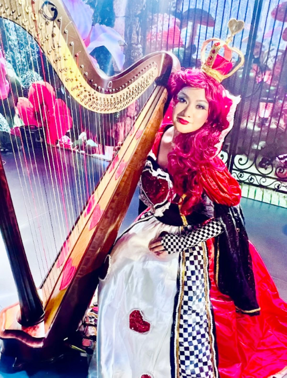 QUEEN OF HARPS — Sometimes, performing in gorgeous costumes is part of the job.