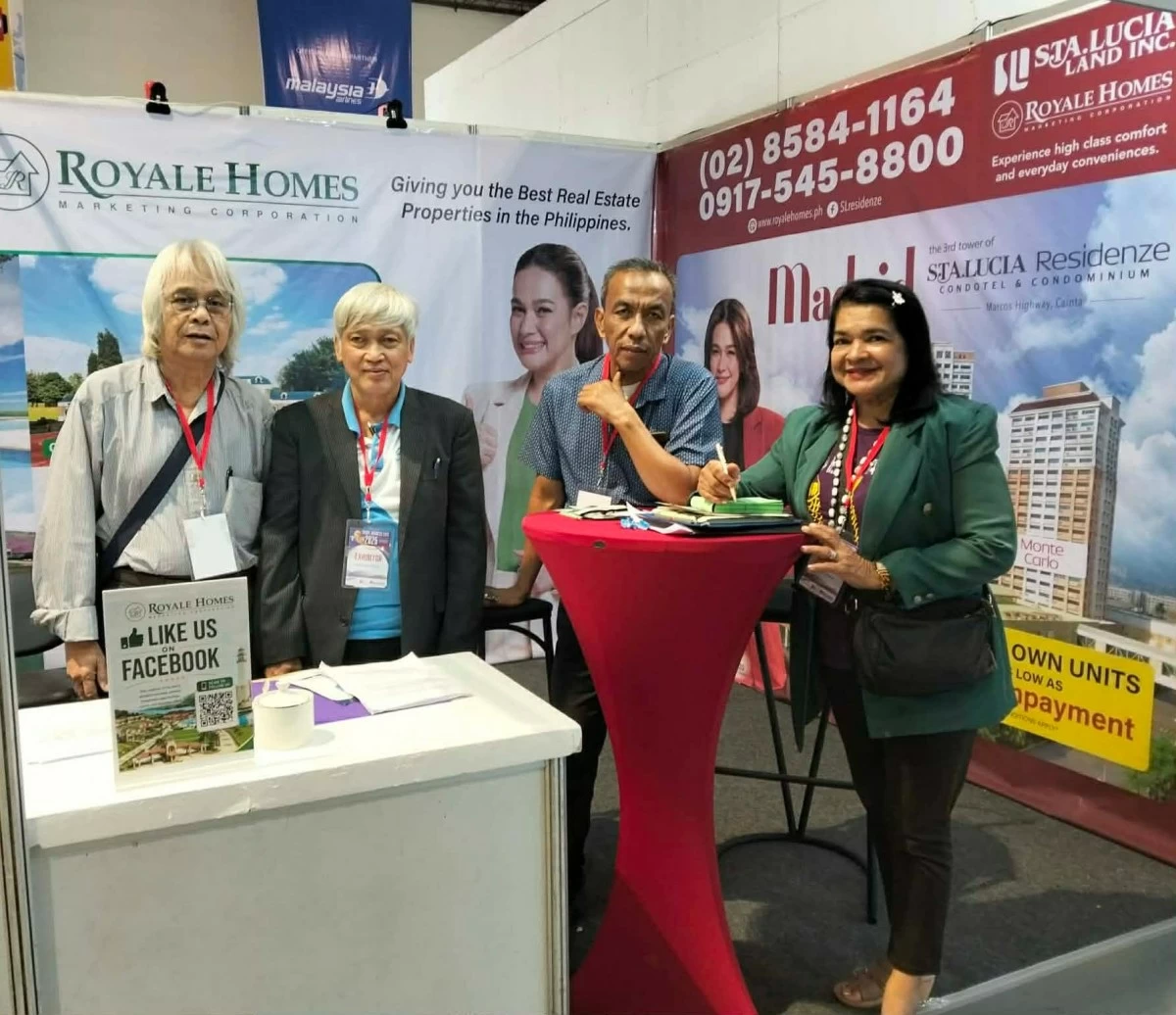 Sales partners under Royale Homes Marketing Corporation warmly welcome attendees at their booth during the three-day event. (Photo: Royale Homes)