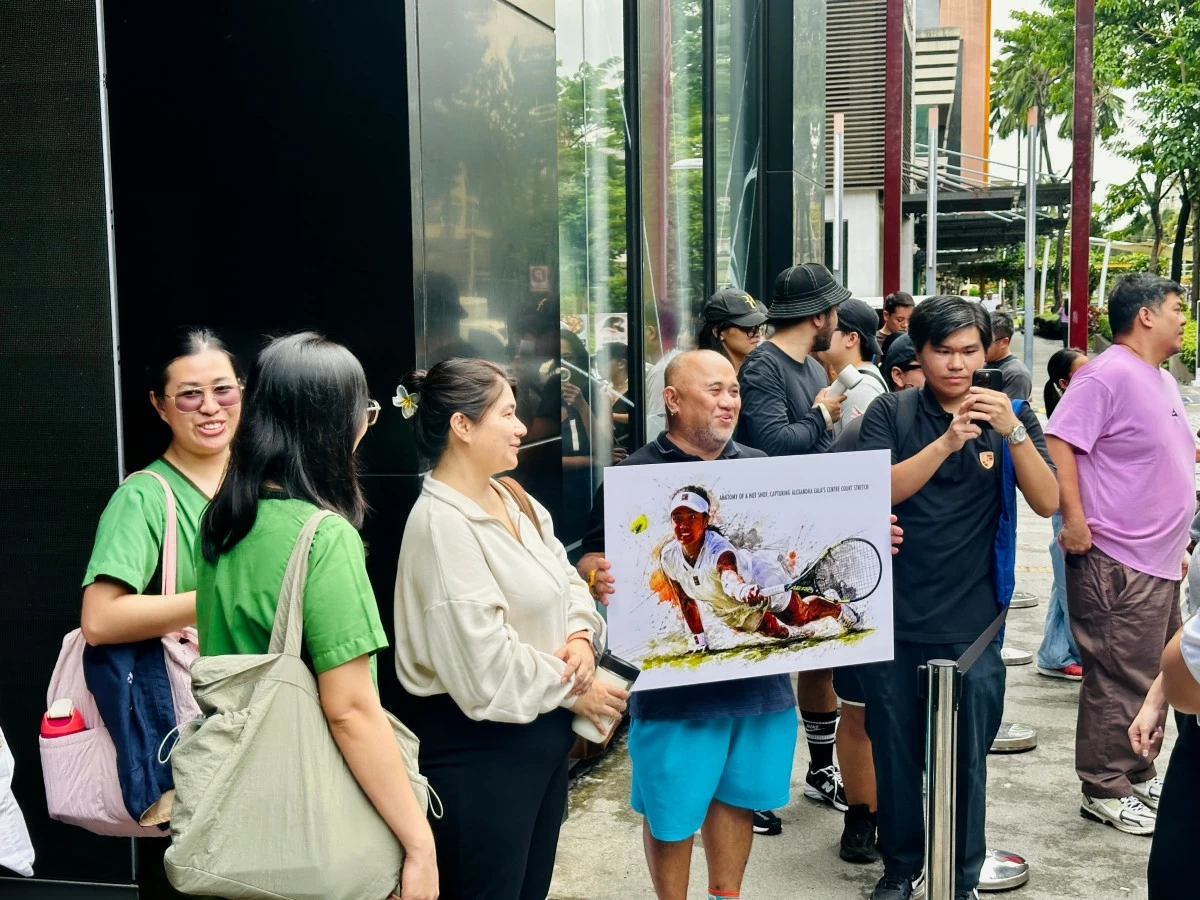 Fans and supporters gather outside the Nike store in Taguig City.