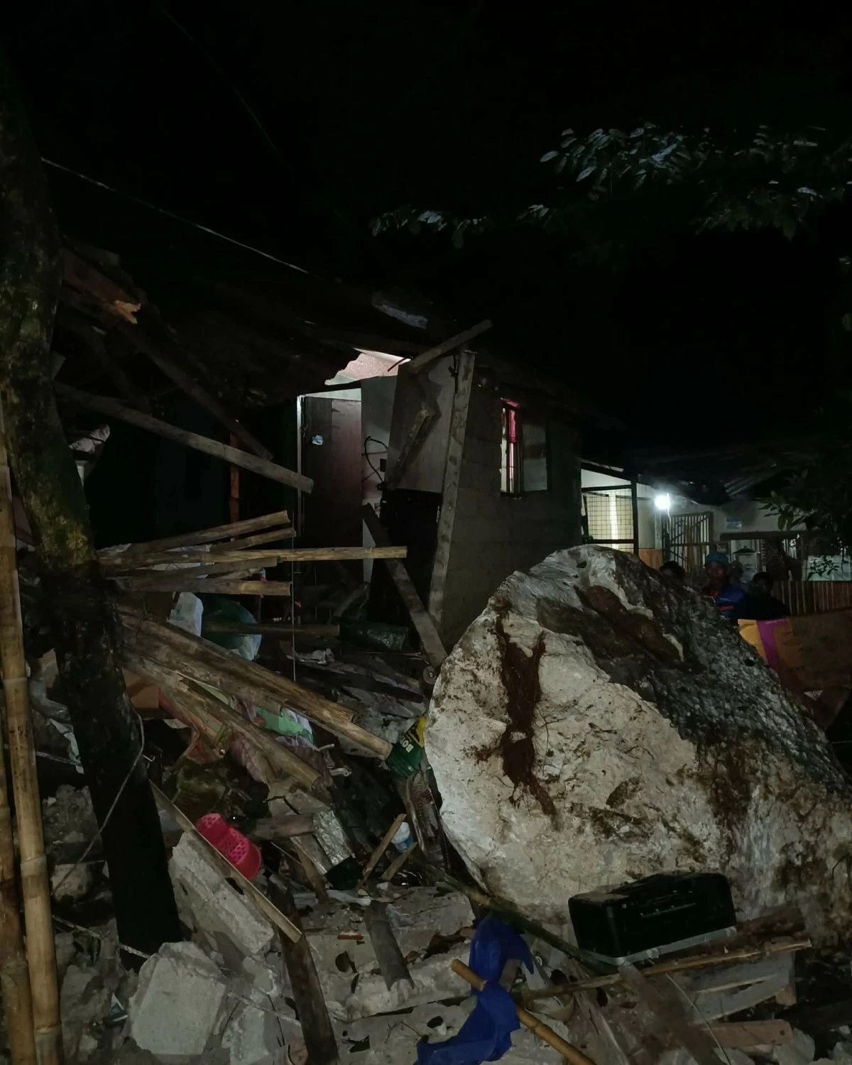 Huge rocks are seen after a rockslide damaged houses in Barangay San Rafael, Montalban, Rizal, injuring three people, including two children. (Photos from Barangay San Rafael - Montalban, Rizal/Facebook)