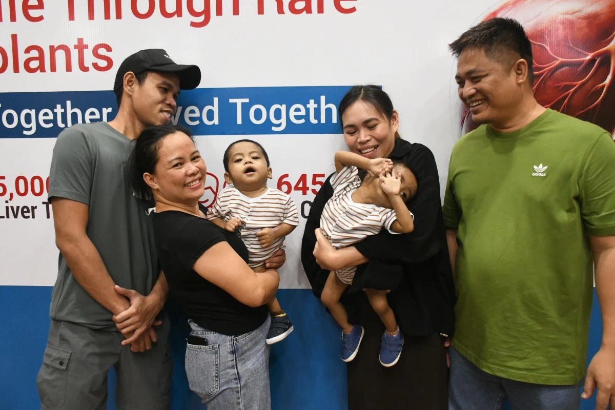 RARE SECOND CHANCE — Filipino twin toddlers Tyler and Kelly Clarito are pictured with their family after undergoing successful living donor liver transplants at Indraprastha Apollo Hospitals in New Delhi, India, in May and June, 2026. From left are Kelly's liver donor and maternal uncle Roy Escasinas; Chingvie Pandeling holding Kelly; Tyler; Tyler's liver donor and mother Daisy Ann Clarito; and the twins' father, Wilson Clarito. The twins are expected to return to the Philippines on Aug. 1, 2026, after nearly three months in India, where they underwent the rare surgeries and post-transplant recovery. (Photo from Apollo Hospitals)