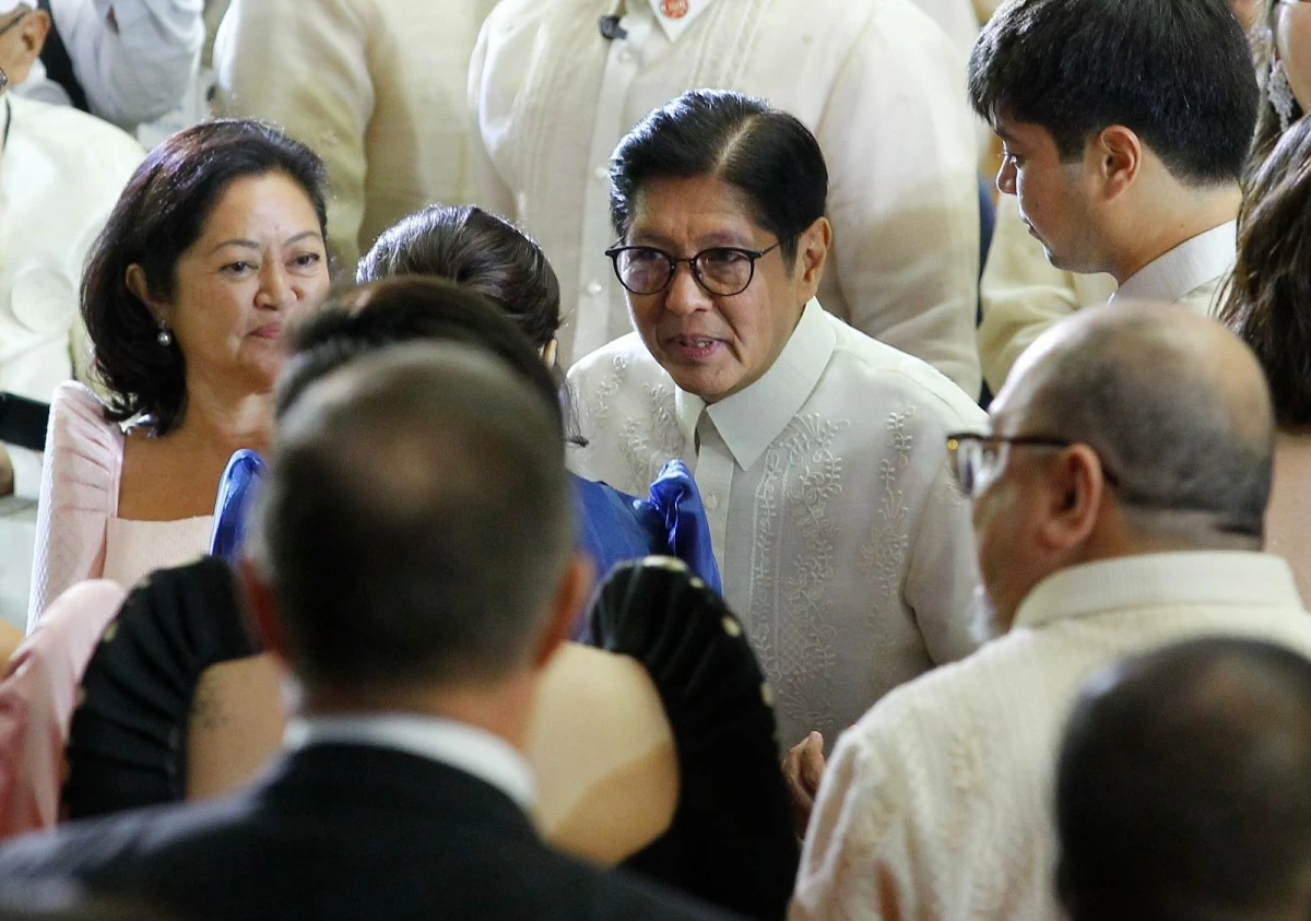 President Ferdinand R. Marcos Jr. interacts with officials and guests after delivering his fifth State of the Nation Address (SONA) at the Batasang Pambansa on July 27, 2026. (Mark Balmores)