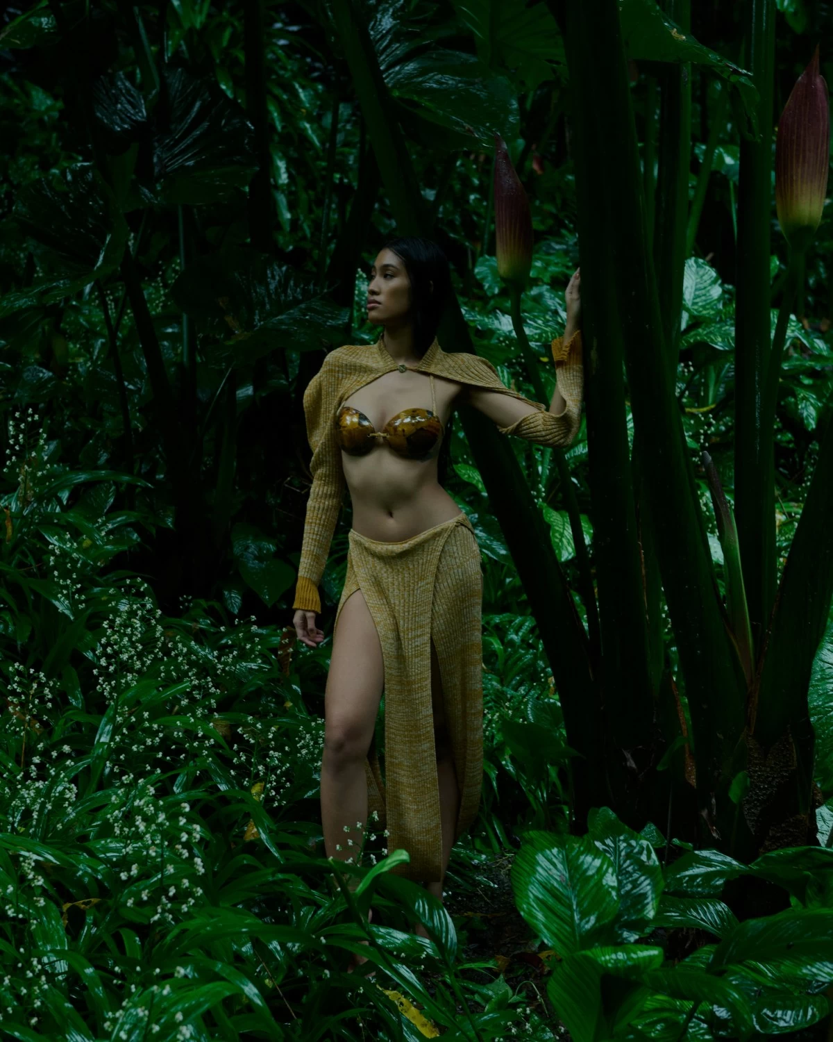 Knitted draped sleeve cape in cotton and piña; mother of Pearl bikini top in amber tortoise color; and knitted draped skirt in cotton and piña