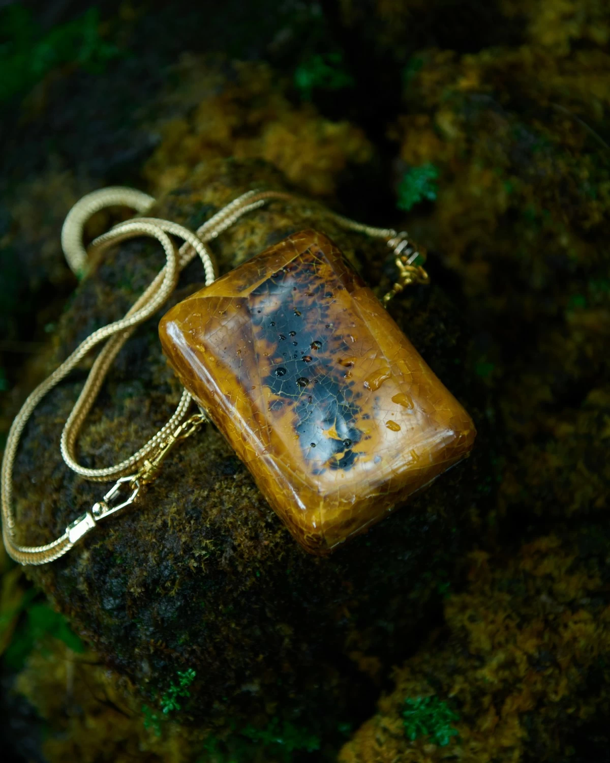 Mother of pearl mini minaudiere in amber tortoise color