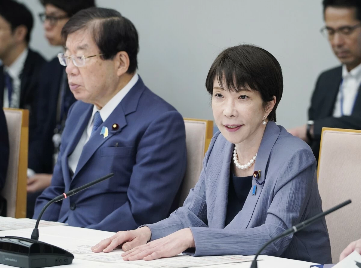 Japanese Prime Minister Sanae Takaichi (right) speaks at a ministerial meeting on crime prevention at the prime minister's office in Tokyo on Tuesday, July 28.