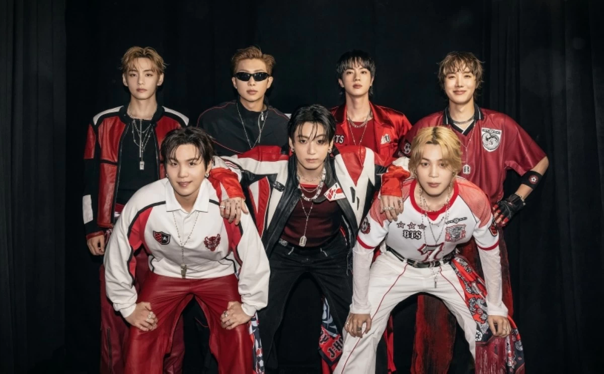 BTS wearing the outfits that were auctioned for the benefit of the FIFA Global Citizen Education Fund (X)