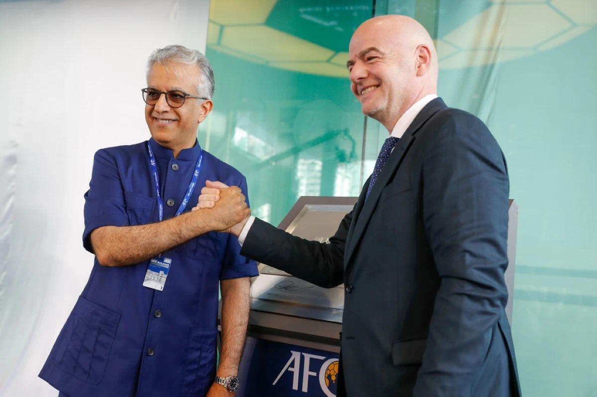 FILE - Asia Football Confederation President Salman Bin Ibrahim Al-Khalifa, left, poses with FIFA President Gianni Infantino during an inauguration ceremony for the new building of the Asia Football Confederation in Kuala Lumpur, Malaysia Tuesday, Oct. 30, 2018. (AP Photo/Vincent Thian, File)