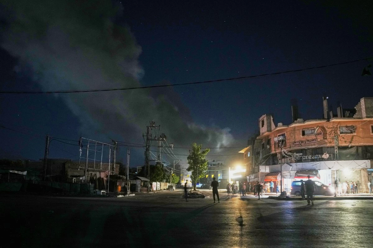 A plume of smoke rises following an Israeli military strike in Nuseirat, central Gaza Strip, Friday, July 31, 2026. (AP Photo/Abdel Kareem Hana)