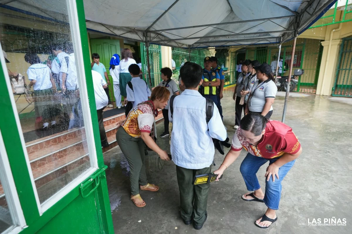 

Students undergo security screening at CAA National High School as the Las Piñas City government strengthens campus safety measures (Photo from Las Piñas PIO)
