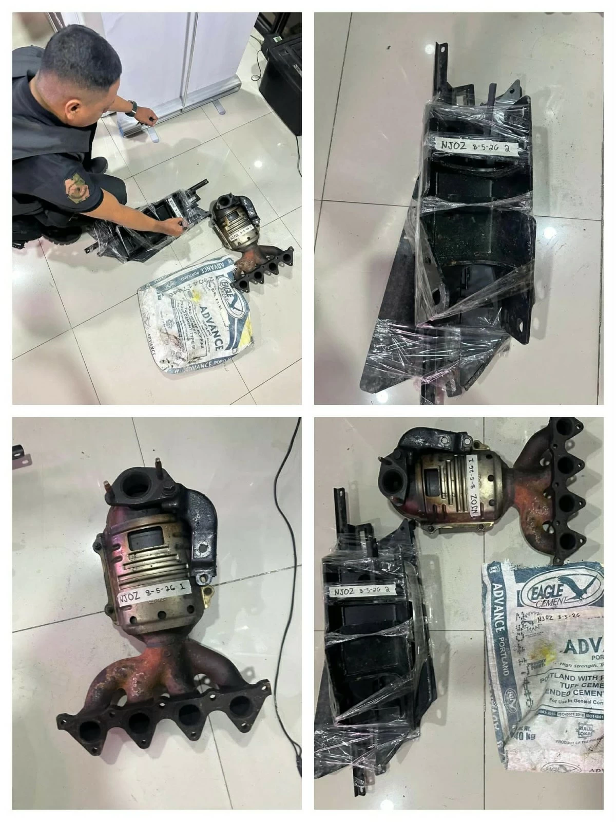 Recovered from the two alleged burglars were auto parts worth about P40,000, including a dismantled bumper support, a catalytic exhaust, and the cement sack used to transport the stolen items. (Photo courtesy of QCPD)
