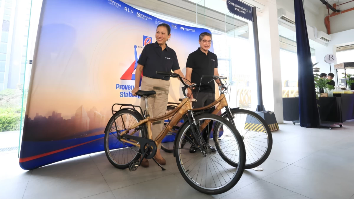 Lance Gokongwei and Mybelle Aragon-GoBio pose with bicycles at the unveiling of John Gokongwei Jr. Boulevard. The gesture pays homage to the resourcefulness and survival tactics of late patriarch John Gokongwei Jr., whose adolescent bicycle trade formed the bedrock of one of the Philippines’ largest conglomerates. (Photo by Santi San Juan)