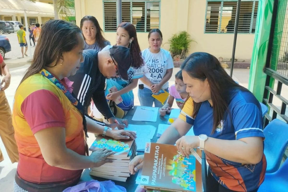 TEACHERS of Heracleo Casco Memorial National High School in Santa Maria, Davao Occidental distribute learning materials to parents. (DepEd-Davao Occidental photo) 