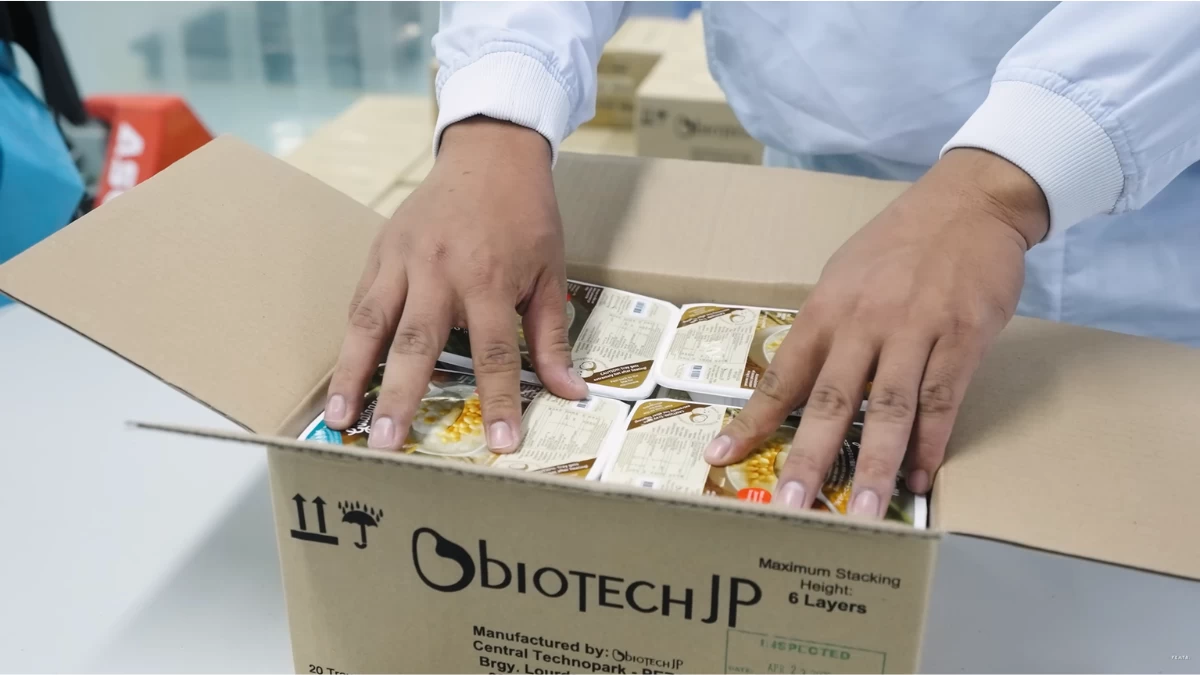 Products being packed for shipment at BiotechJP's processing facility in Tarlac, where Organic Options' functional rice range is manufactured through a partnership combining local market understanding with Japanese food technology.