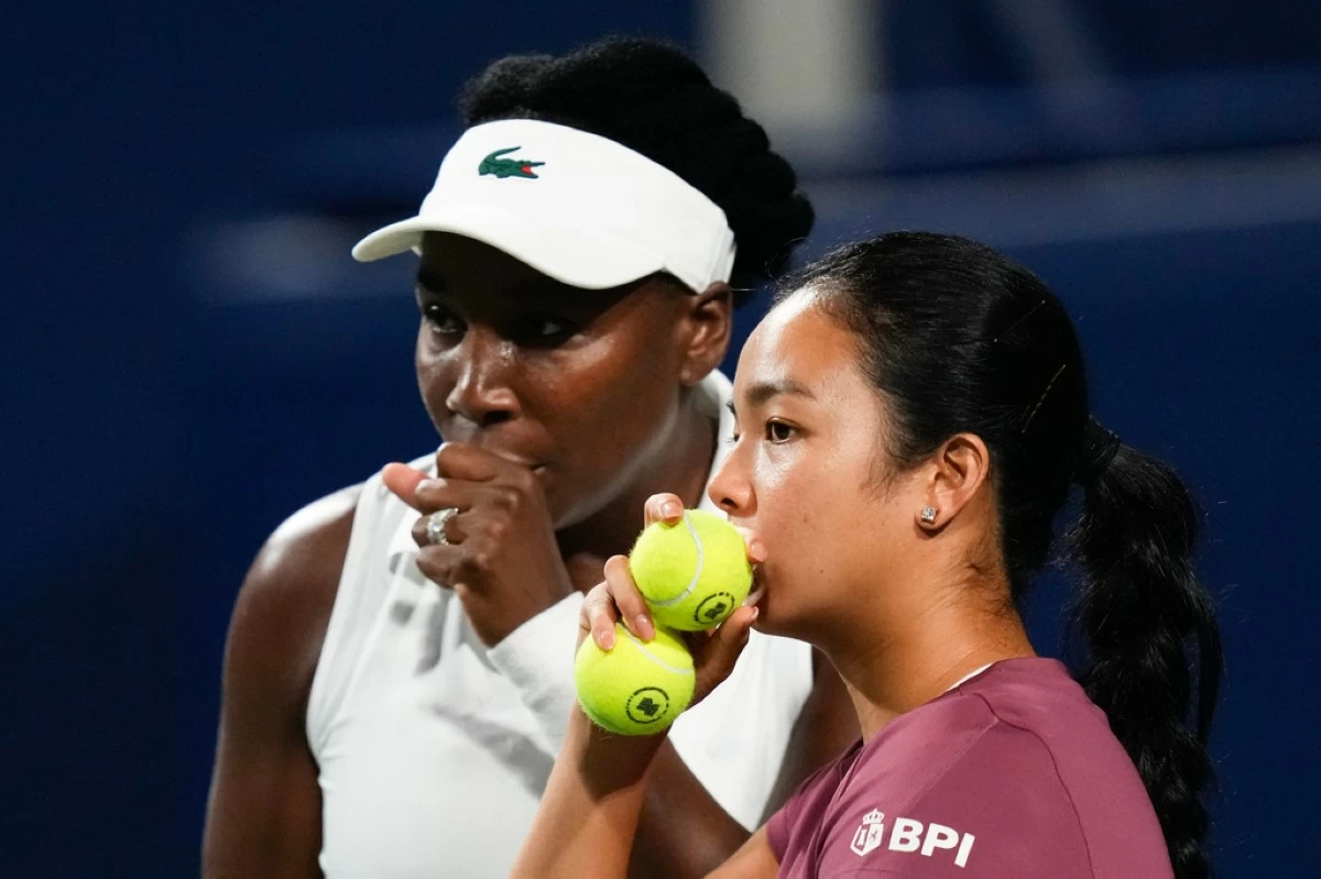United States' Venus Williams, left, confers with partner, Philippines' Alexandra Eala in a doubles match against Japan's Miyu Kato and Liudmila Samsonova during a National Bank Open tennis match in Toronto on Thursday, Aug. 6, 2026. (Chris Young/The Canadian Press via AP)