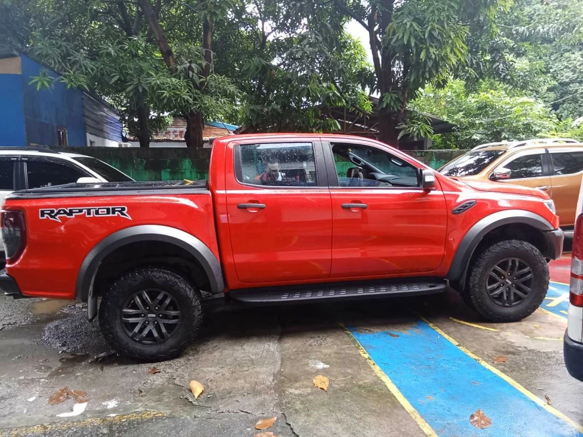 The red Ford Ranger allegedly sold for P970,000 with fake documents is recovered by Quezon City Police District operatives in Lower Bicutan, Taguig City. (Photo courtesy of QCPD)