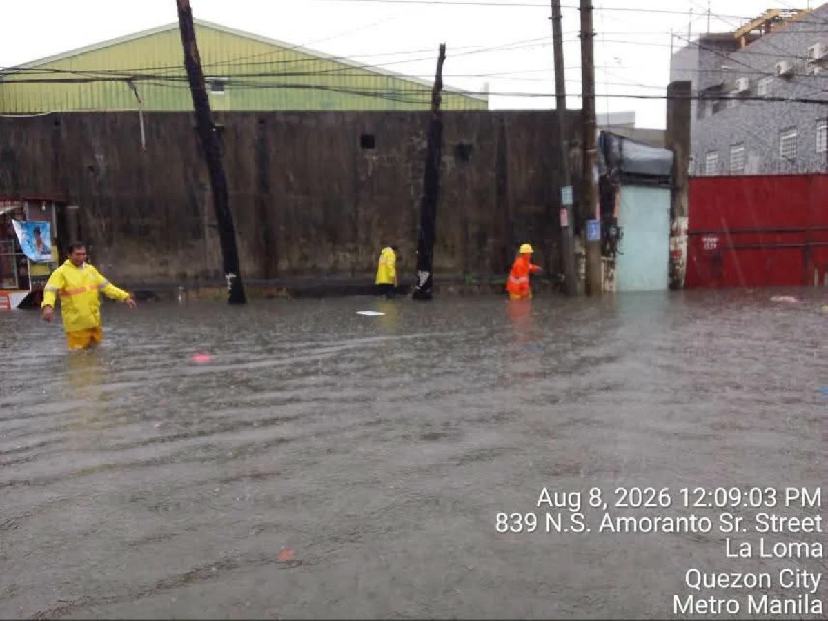 Quezon City Department of Engineering (QCDE) personnel conduct clearing operations along NS Amoranto Sr. Street amid continued rains in Quezon City. Photo courtesy of the Quezon City government.