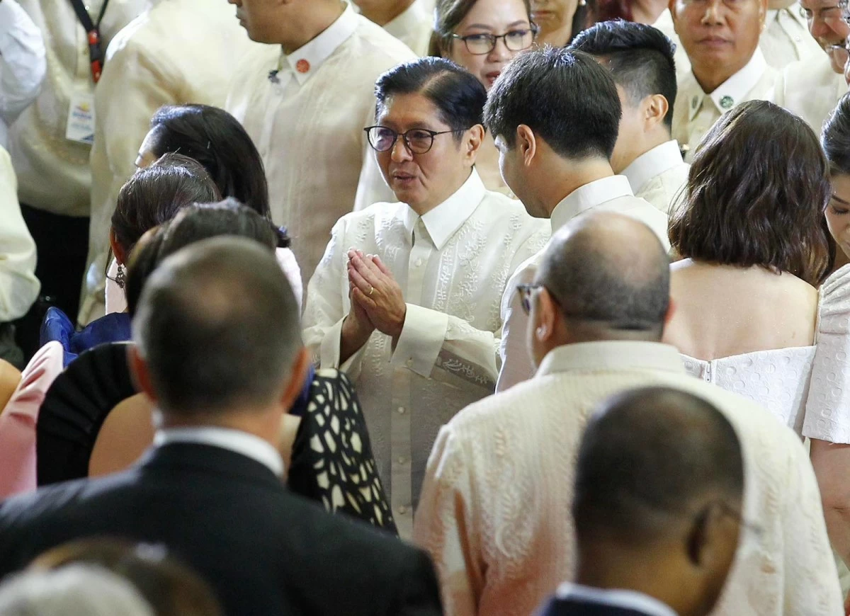President Ferdinand R. Marcos Jr. interacts with officials after delivering his State of the Nation Address (SONA) inside the plenary hall inside the Batasang Pambansa on July 27, 2026. (Mark Balmores)