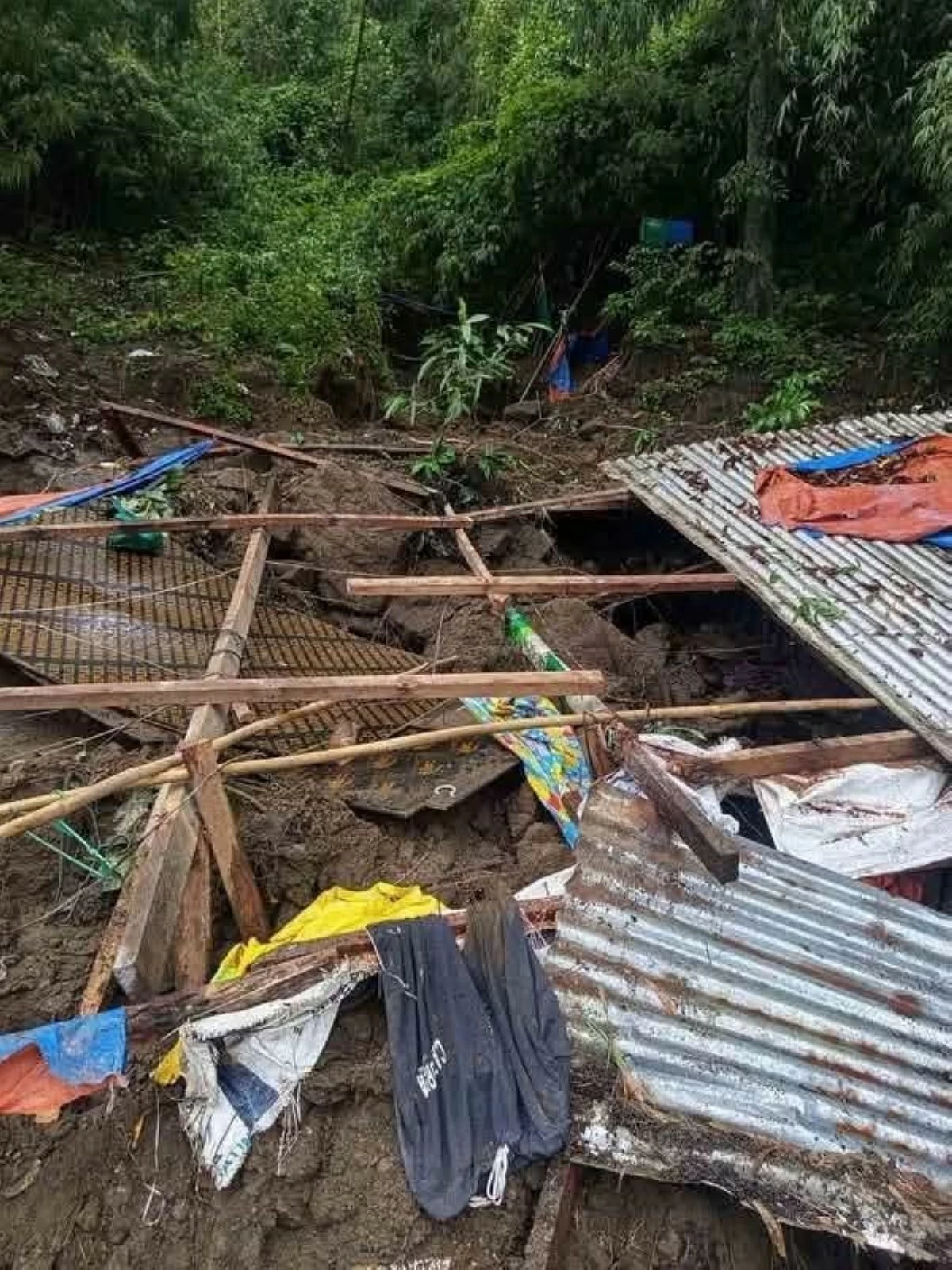‎A laborer was killed in a landslide in Barangay Calumala, Santa Teresita, Batangas on Saturday night, Aug. 8. (Photo via Danny Estacio)