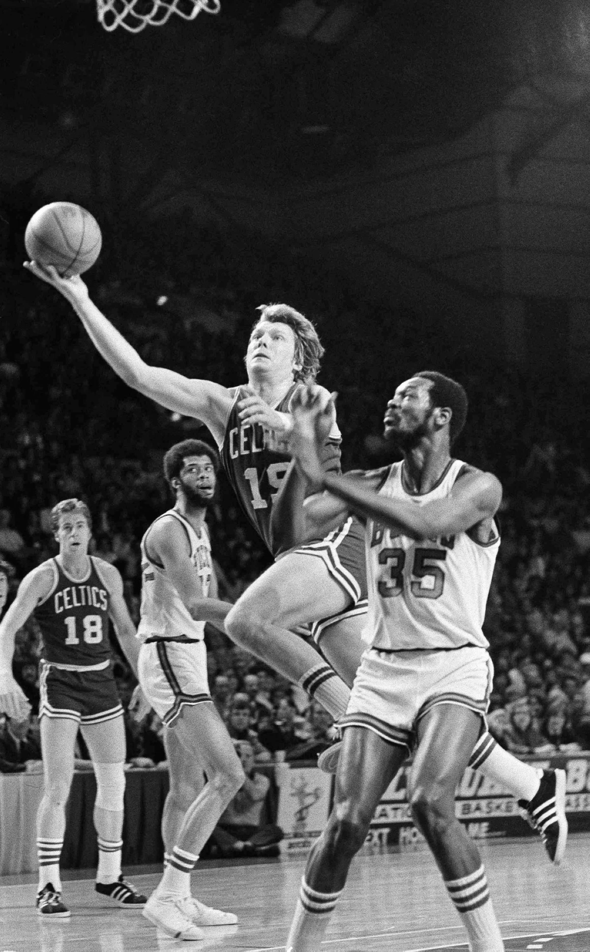 FILE - Boston Celtics' Don Nelson (19) goes to the basket against Milwaukee's Cornell Warner (35) during a NBA Championship game, May 12, 1974, in Milwaukee. (AP Photo, File)