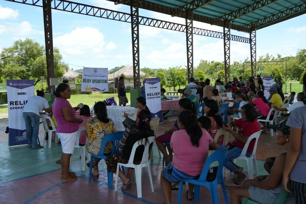 Families in Ilocos Norte receive relief assistance from the Office of the Vice President amid the effects of habagat-enhanced rains and flooding. (OVP photo)