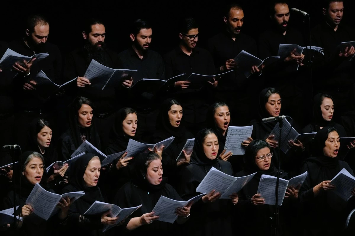Choir performs in a Tehran Symphony Orchestra performance at Unity Hall in Tehran, Iran, Thursday, Aug. 6, 2026. (AP Photo/Vahid Salemi)