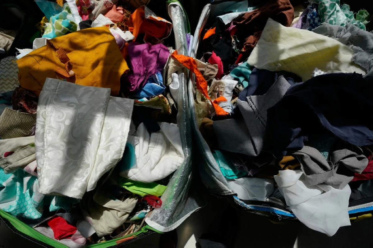 Fabric pieces sit for sale in bins at the Brooklyn Creative Reuse, Wednesday, July 29, 2026, in Brooklyn borough of New York. (AP Photo/Alyssa Goodman)