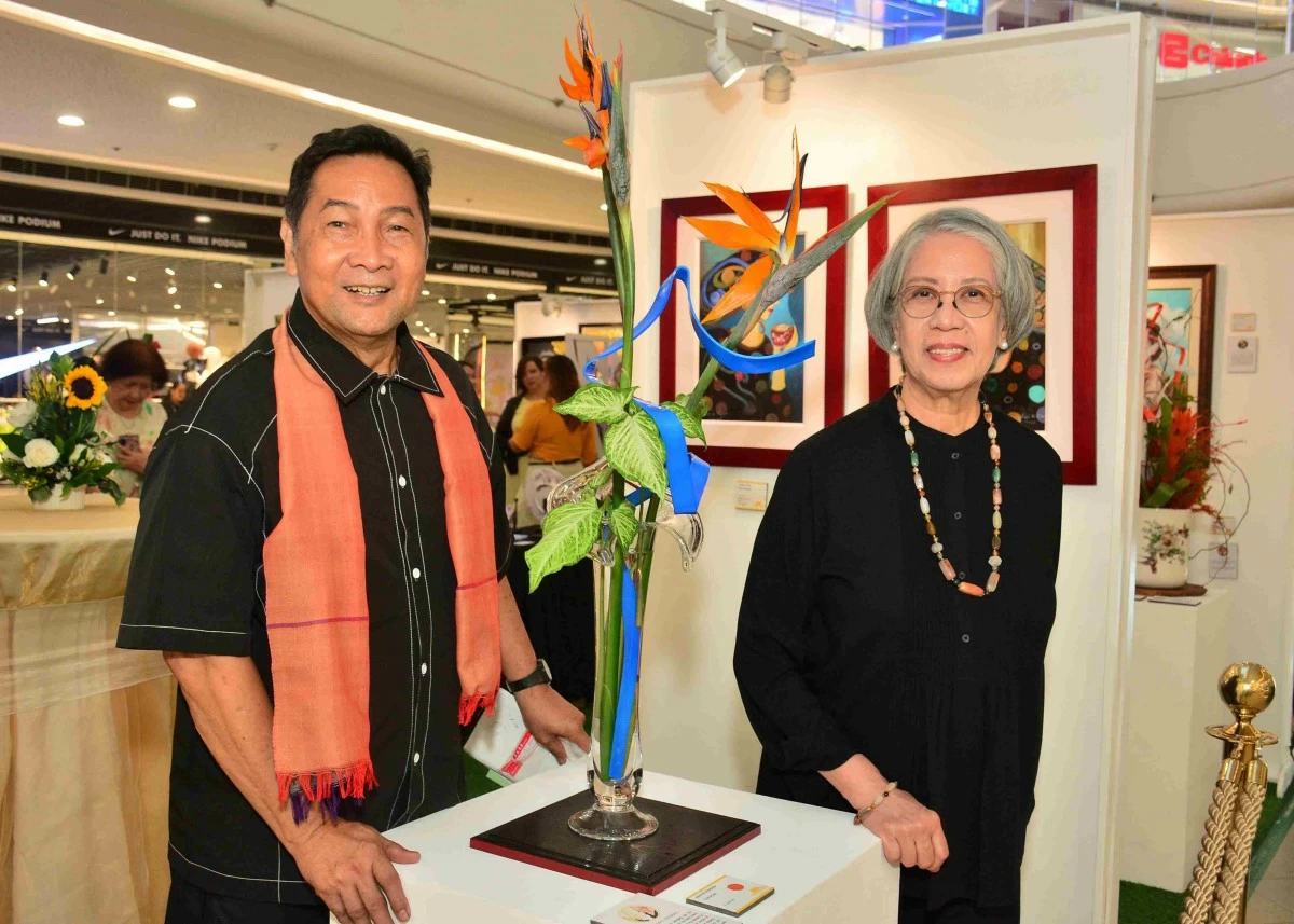 Sunshine Place Ikebana Instructor Marc Tomas and student Maricor Mendoza with her Curvature arrangement
