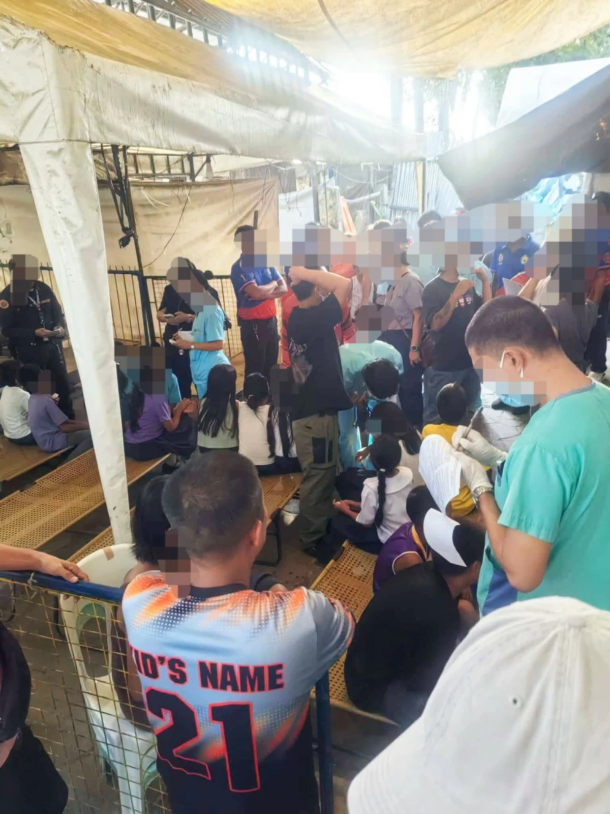 Rescuers assist 17 Grade 5 pupils of a public elementary school in Barangay Tiglawan, Cadiz City, Negros Occidental, who fell ill after consuming the seeds of kasla or tuba-tuba on Wednesday, August 12. (Cadiz CDRRMO)

