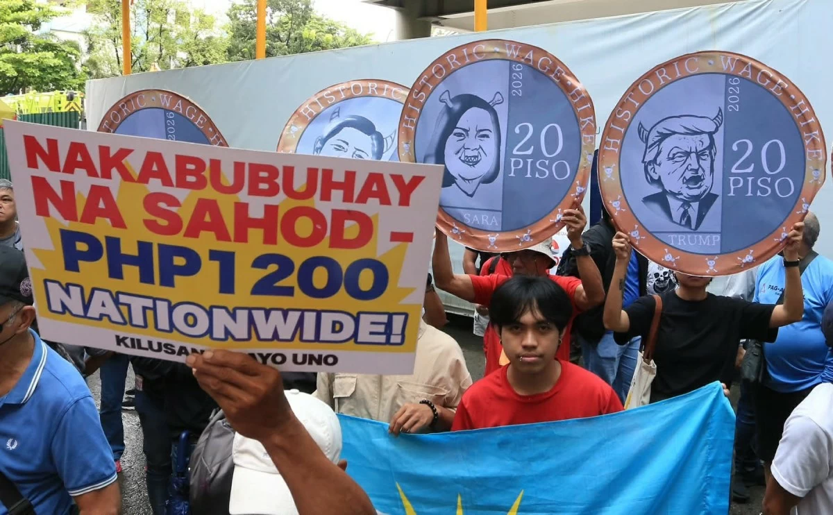 Labor groups and workers’ coalitions staged a protest outside the Pasig Regional Trial Court on Monday, Aug. 3, condemning the temporary restraining order that suspended the P85 minimum wage hike in Metro Manila. (Photo by Santi San Juan)