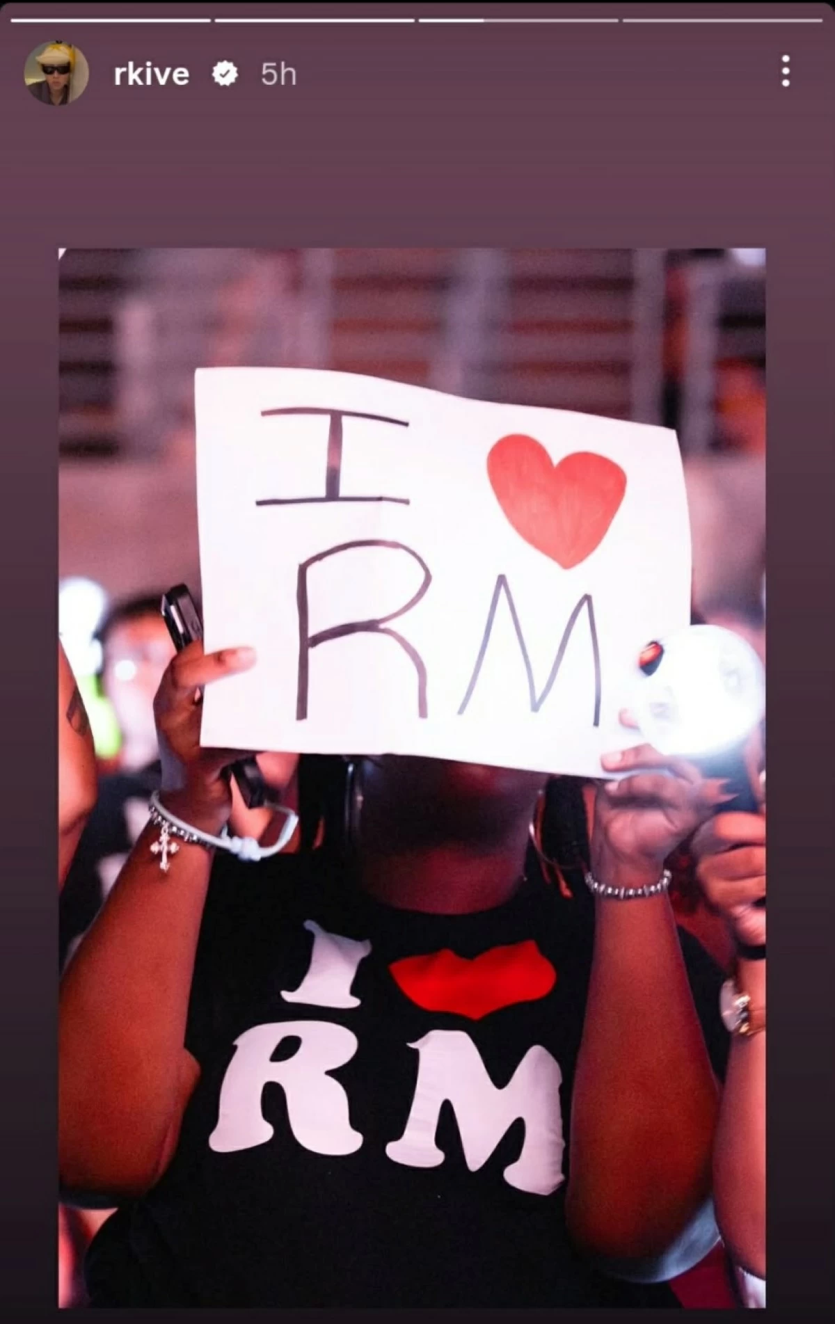 A Black woman holding an 
