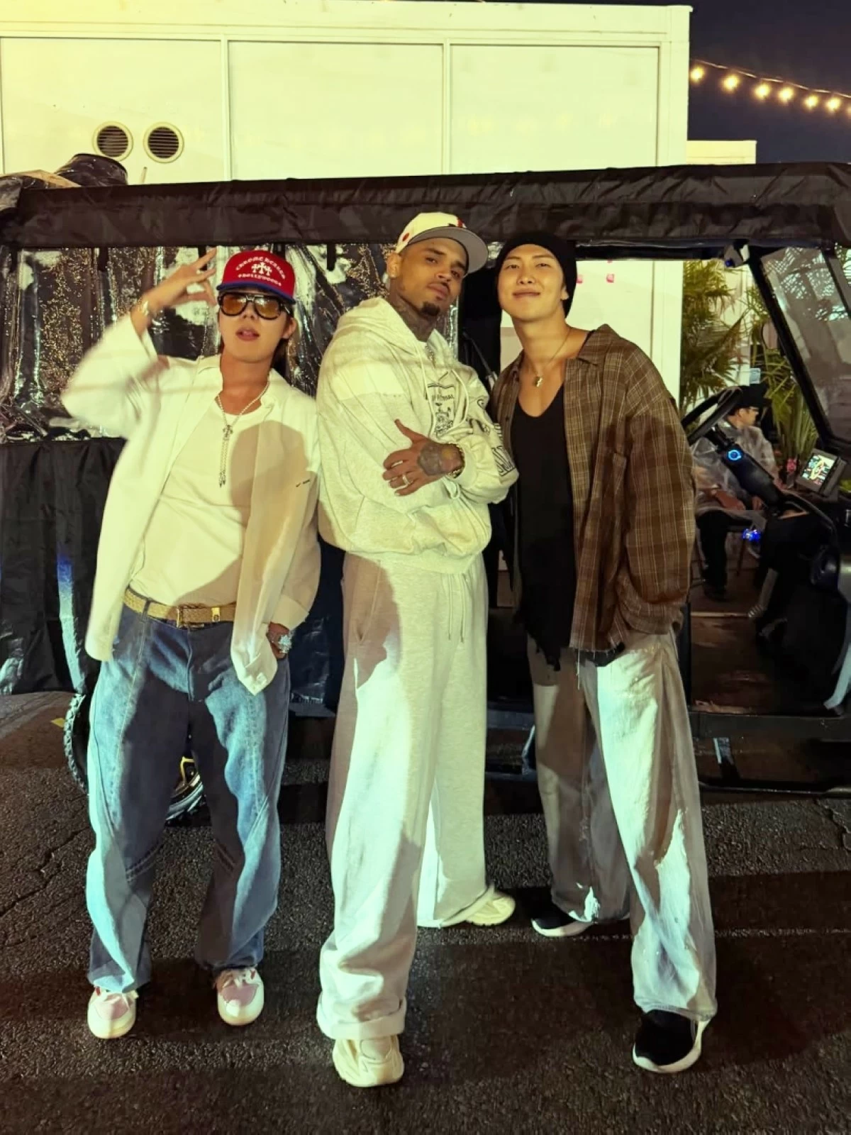 Chris Brown with BTS' RM (right) and J-Hope at his and Usher's concert (Chris Brown's Instagram) 