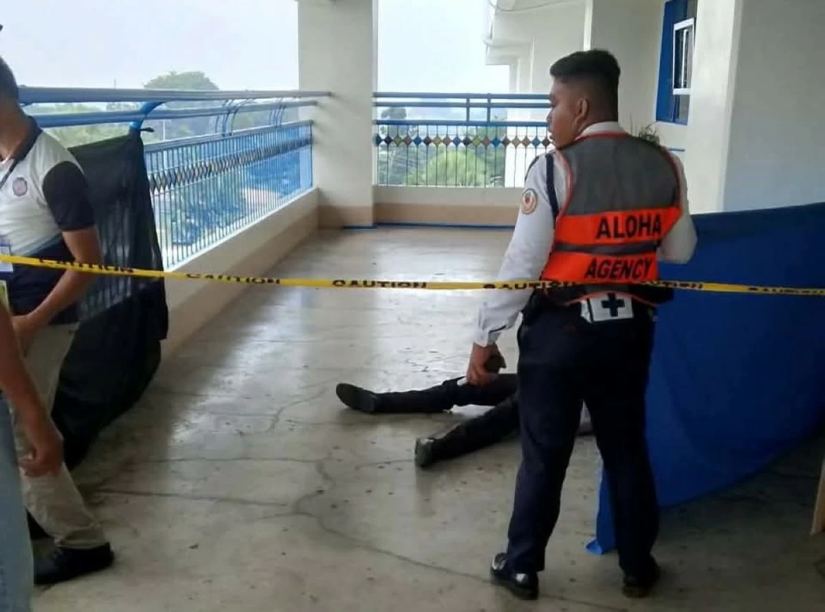 The suspect lies on the floor of the school after the shooting