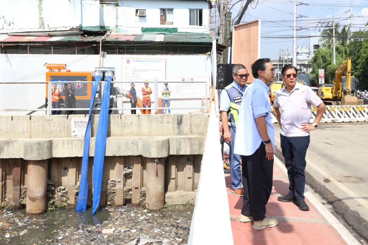 President Ferdinand 'Bongbong' Marcos Jr., together with DPWH Secretary Vince Dizon, inspects the ongoing construction of a flood mitigation structure along G. Araneta Avenue to the San Juan River in Quezon City on Wednesday, May 20, 2026. (Santi San Juan)