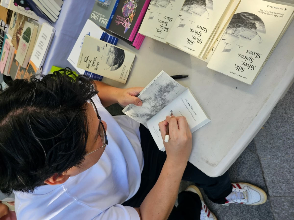Mangubat at Everything’s Fine’s signing event for Silk, Silver, Spices, Slaves at Dia del Libro 2025. 