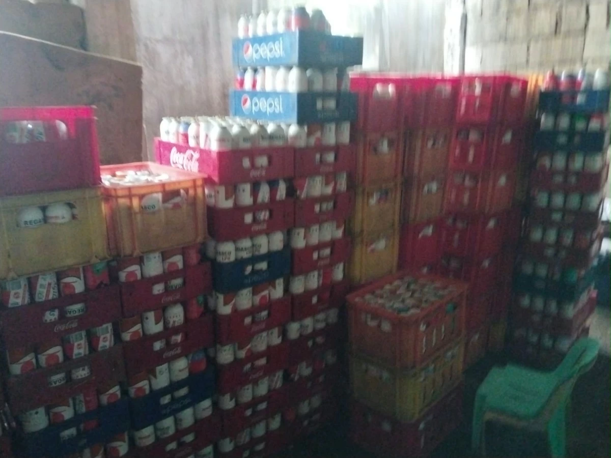 Several butane canisters were seized in a raid against illegal refilling operation in a senior citizen's house in Barangay Estefania, Bacolod City on Tuesday, August 18. (Gracelyn Lobaton)