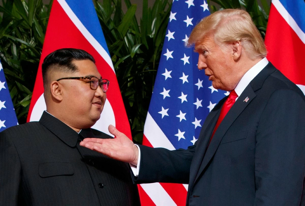 U.S. President Donald Trump, right, meets with North Korean leader Kim Jong Un on Sentosa Island in Singapore, on June 12, 2018. (AP Photo/Evan Vucci, File)