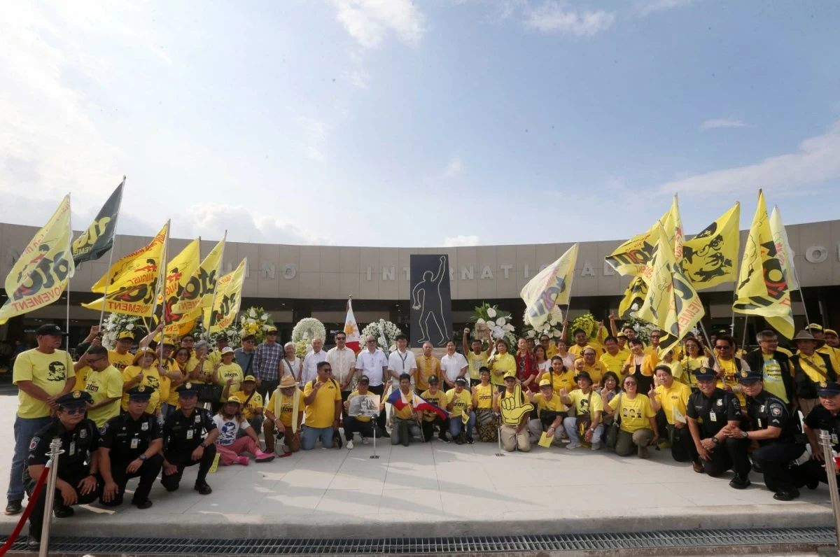 National Historical Commission of the Philippines (NHCP) Chair Regalado Trota Jose Jr. (standing in the middle wearing a yellow shirt) leads the flower offering at Terminal 1 of the Ninoy Aquino International Airport (NAIA) in Parañaque City on August 21, 2026, marking the 43rd anniversary of the death of former Senator Benigno “Ninoy” Aquino Jr. The commemoration was organized by the NHCP in partnership with the New NAIA Infrastructure Corporation, Manila International Airport Authority, Human Rights Violations Victims’ Memorial Commission, Spirit of EDSA Foundation, Bantayog ng mga Bayani Foundation, Project Gunita, August Twenty-One Movement, Chino Roces Foundation, NAMSERV, and Earthsaver. The ceremony honors Aquino’s legacy and recalls his assassination at the airport on August 21, 1983, an event that became a turning point in the country’s struggle for democracy. (Mark Balmores/MANILA BULLETIN)