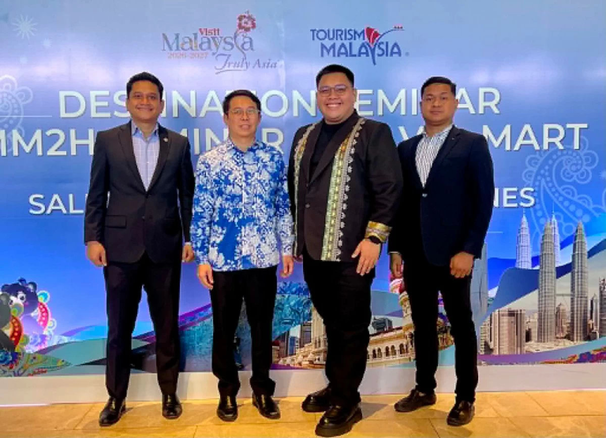 Malaysia Tourism Deputy Director General Lee Thai Hung and Davao City Tourism Operations Office Chief Willenito Tormis (center), with two Malaysian delegates, pose for a photo during the Visit Malaysia 2026 Destination Seminar and Travel Mart on Thursday, August 20, at Dusit Thani Residence Davao in Lanang.  (Photo via Ivy Tejano / MB)
