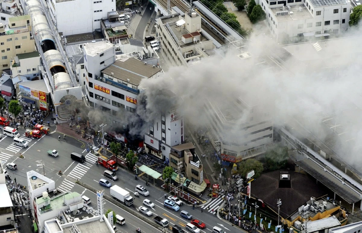 This photo shows a deadly fire at a pachinko parlor in Osaka, western Japan, July 5, 2009. (Kyodo News via AP)