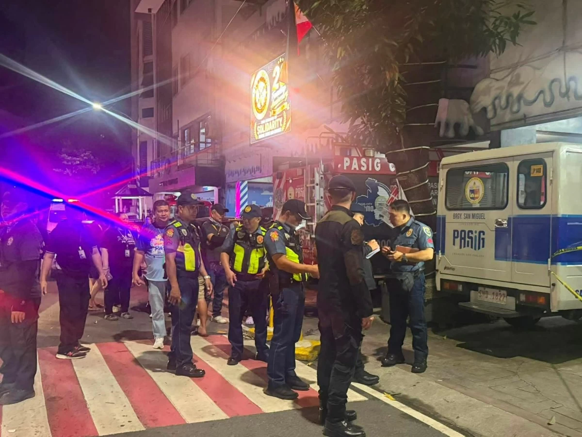 A suspected hand grenade or explosive device is found inside a paper bag at a garbage dump along the boundary of Barangays San Miguel and Sagad in Pasig City. (Photos from Barangay Captain Manny Alba)