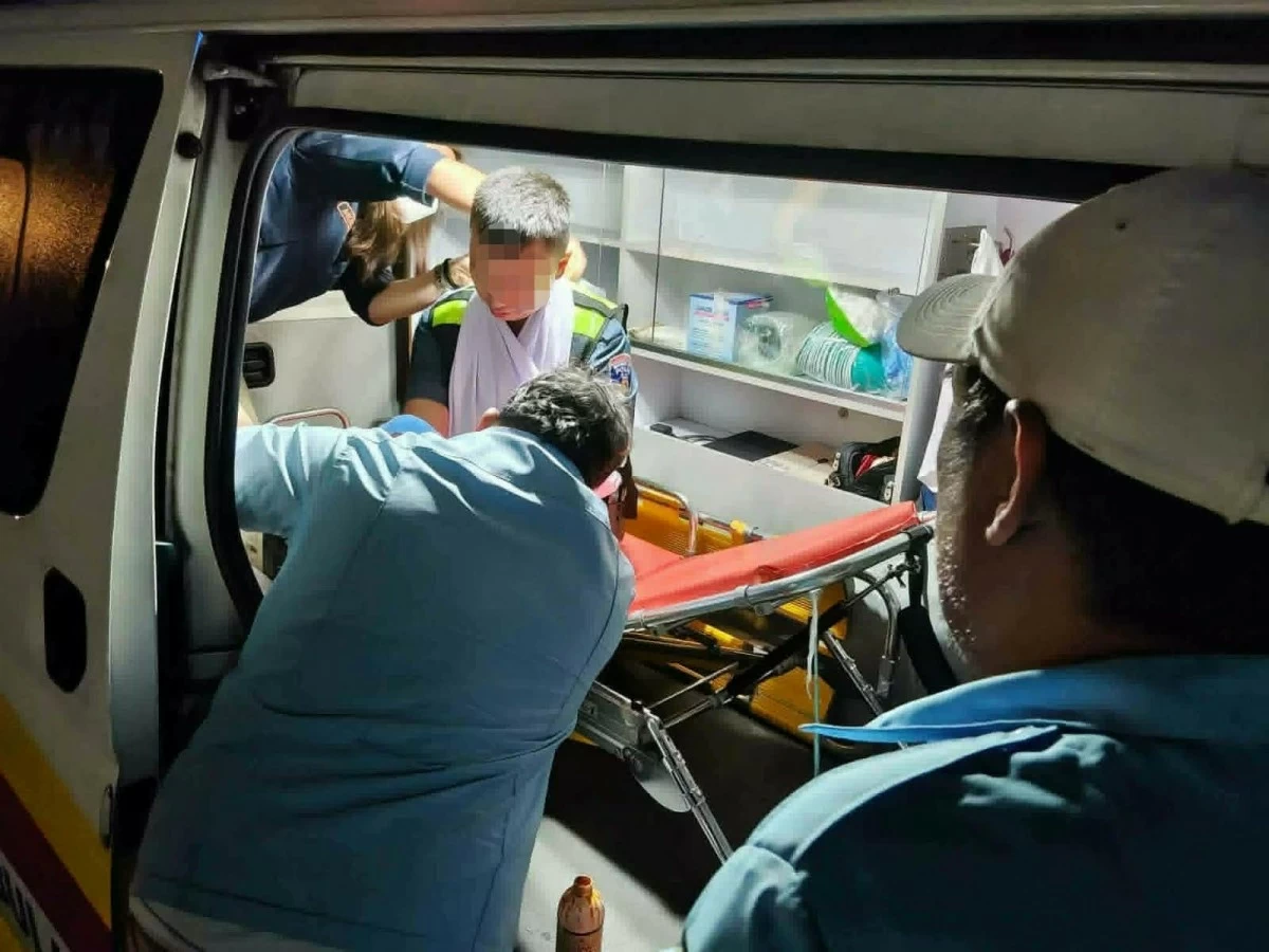 A Marikina police officer is treated after being hit by a motorcycle rider who allegedly attempted to flee a checkpoint in Barangay Fortune, Marikina City. (Photos from EPD)