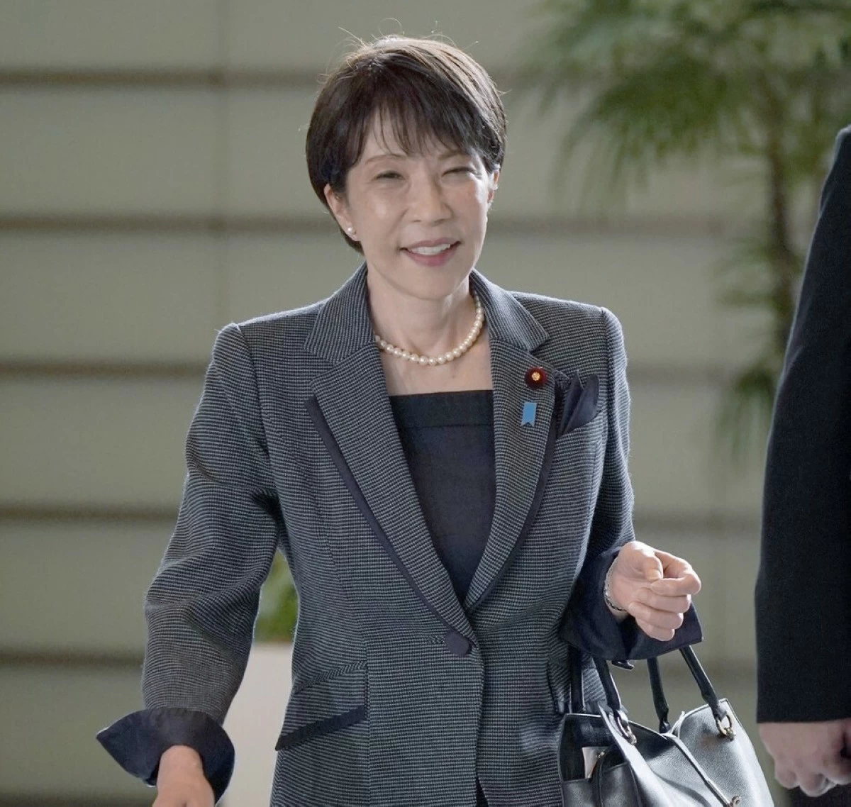 Prime Minister Sanae Takaichi enters the prime minister's office in Tokyo on Friday, Aug. 21.